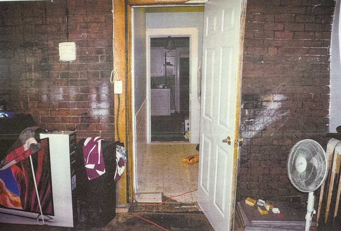 An open door looking down a hallway.