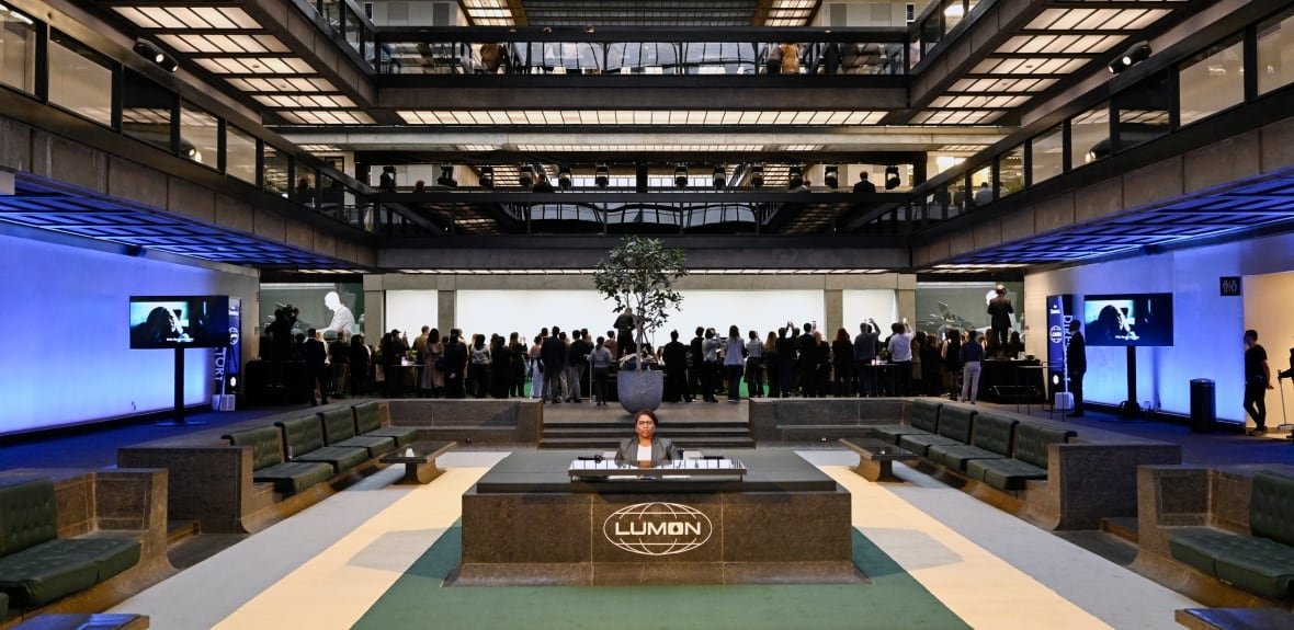 severance-cast-photo-call-at-lumon-industries-set Atrium of building with reception desk in the middle