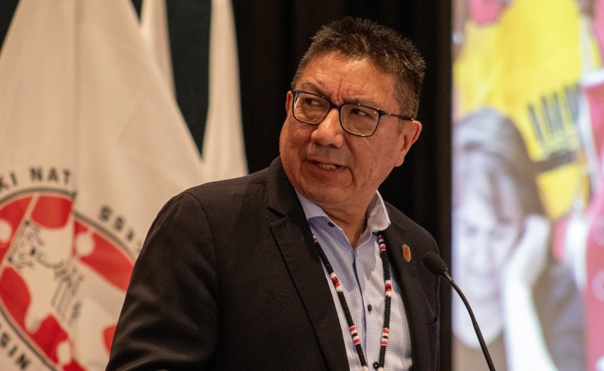 nan-grand-chief-alvin-fiddler A man speaks into a microphone at a podium.