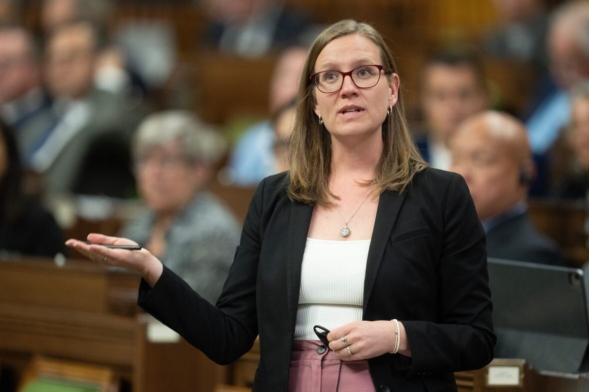 commons-20240926 A woman in a black blazer and white shirt gestures with her hand as she speaks in the House of Commons.