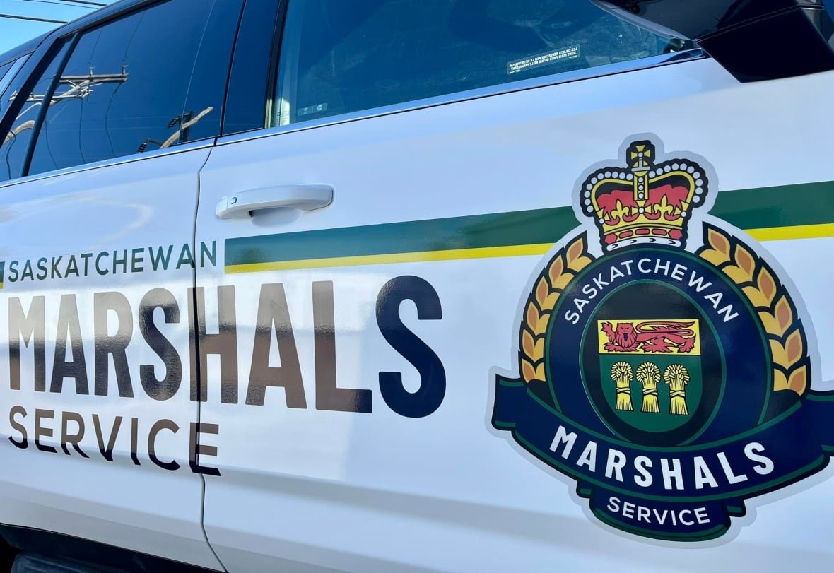 saskatchewan-marshals-service A closeup shows a vehicle with a logo reading "Saskatchewan Marshals Service."