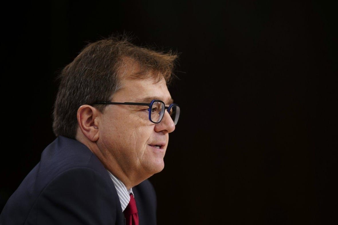 wilkinson A man in a suit and glasses.